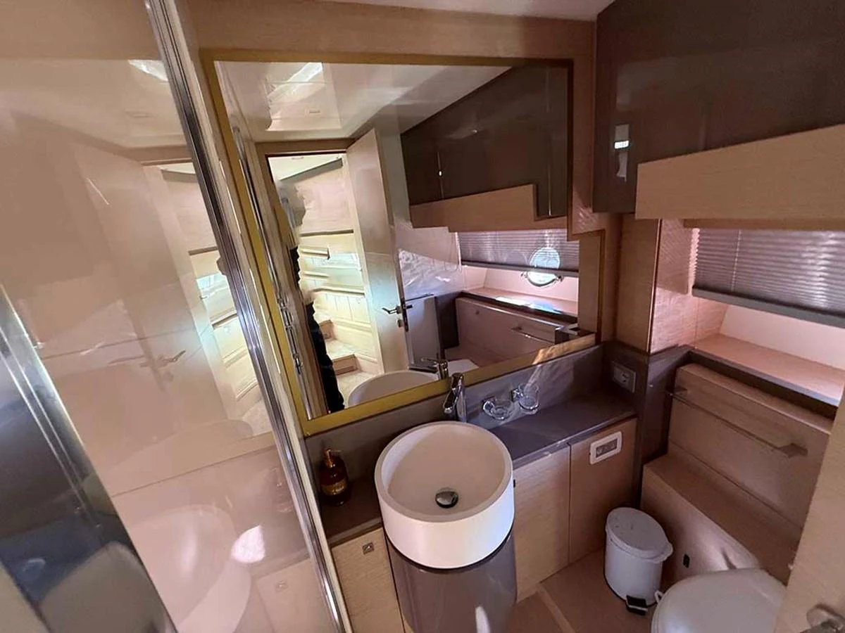 The yacht's bathroom features modern fixtures and a sleek design. aboard LA LUNA Yacht for Sale