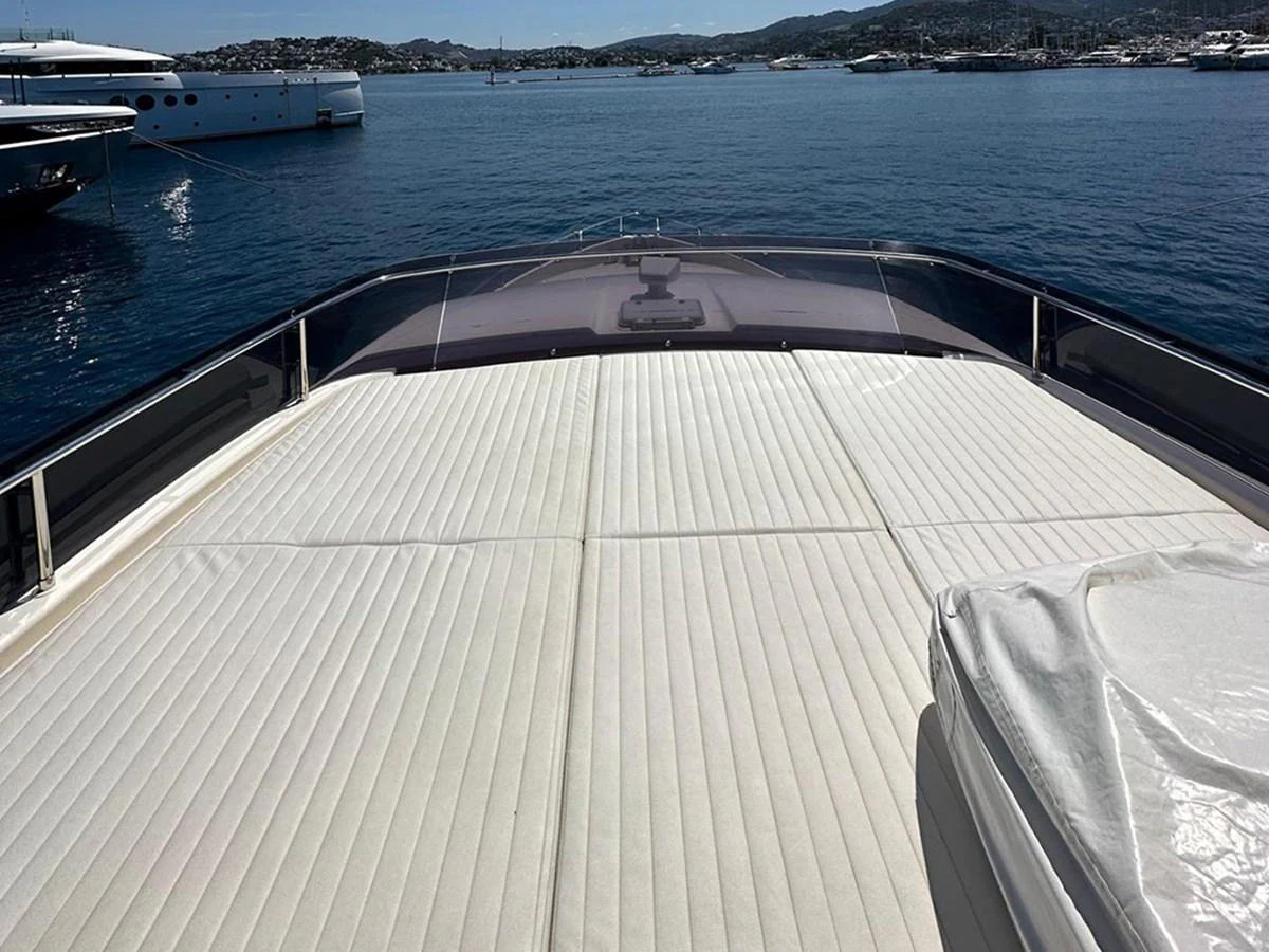 The foredeck features a spacious sunpad area with a view of the surrounding marina. aboard LA LUNA Yacht for Sale