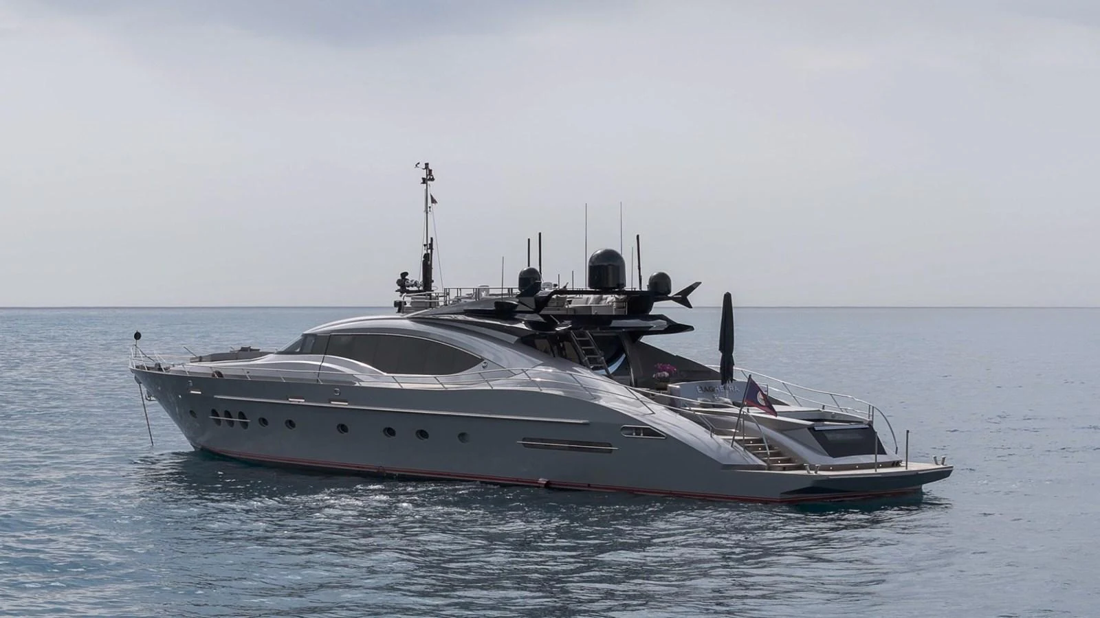 A sleek, modern yacht glides peacefully on calm waters. aboard TAIMARE Yacht for Sale