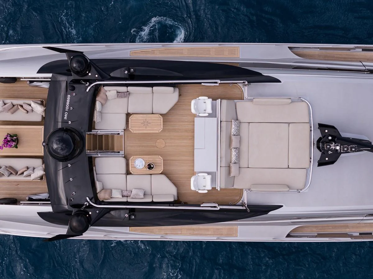 The flybridge offers ample seating and lounging areas with a stunning view of the sea. aboard TAIMARE Yacht for Sale