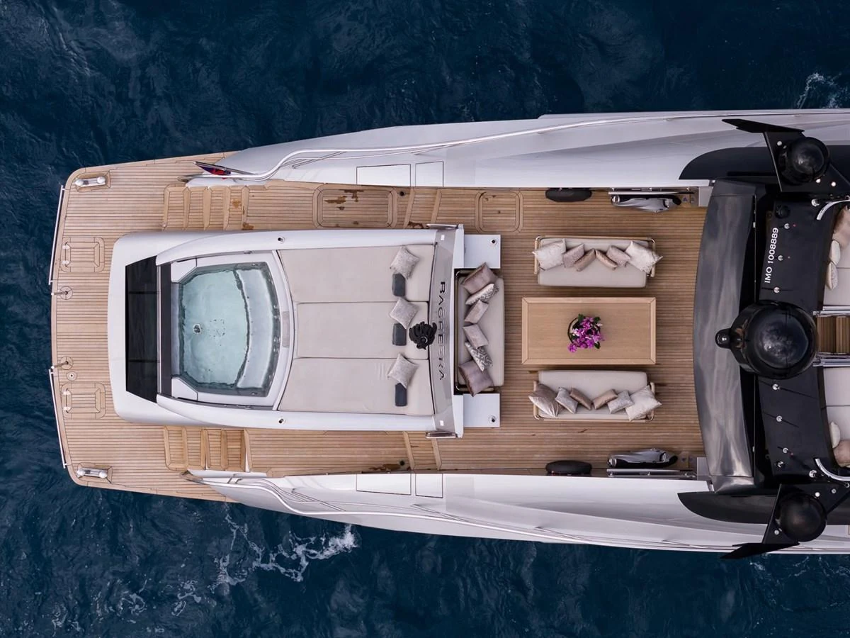 An aerial view of the yacht's sundeck featuring a jacuzzi and comfortable seating area. aboard TAIMARE Yacht for Sale