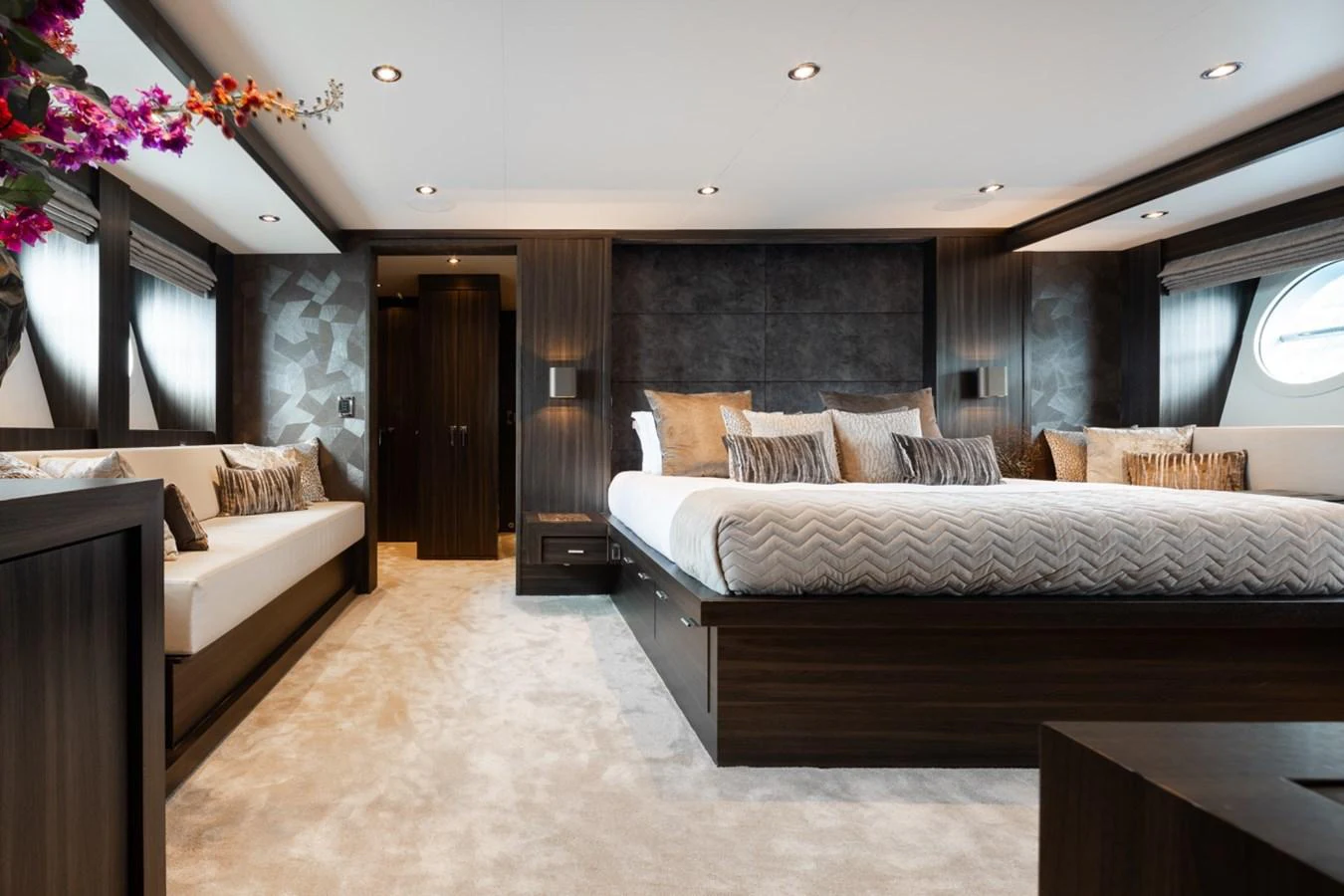 The master stateroom features a luxurious bed with elegant decor and ample natural light. aboard TAIMARE Yacht for Sale