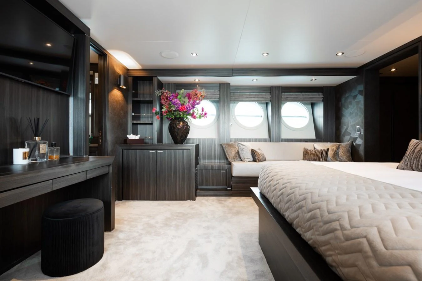 The master stateroom features elegant decor with plush bedding and ample natural light. aboard TAIMARE Yacht for Sale