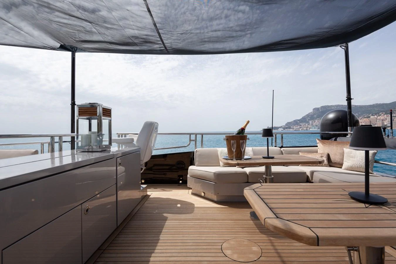 The aft deck offers a luxurious outdoor lounging area with comfortable seating and a stunning ocean view. aboard TAIMARE Yacht for Sale
