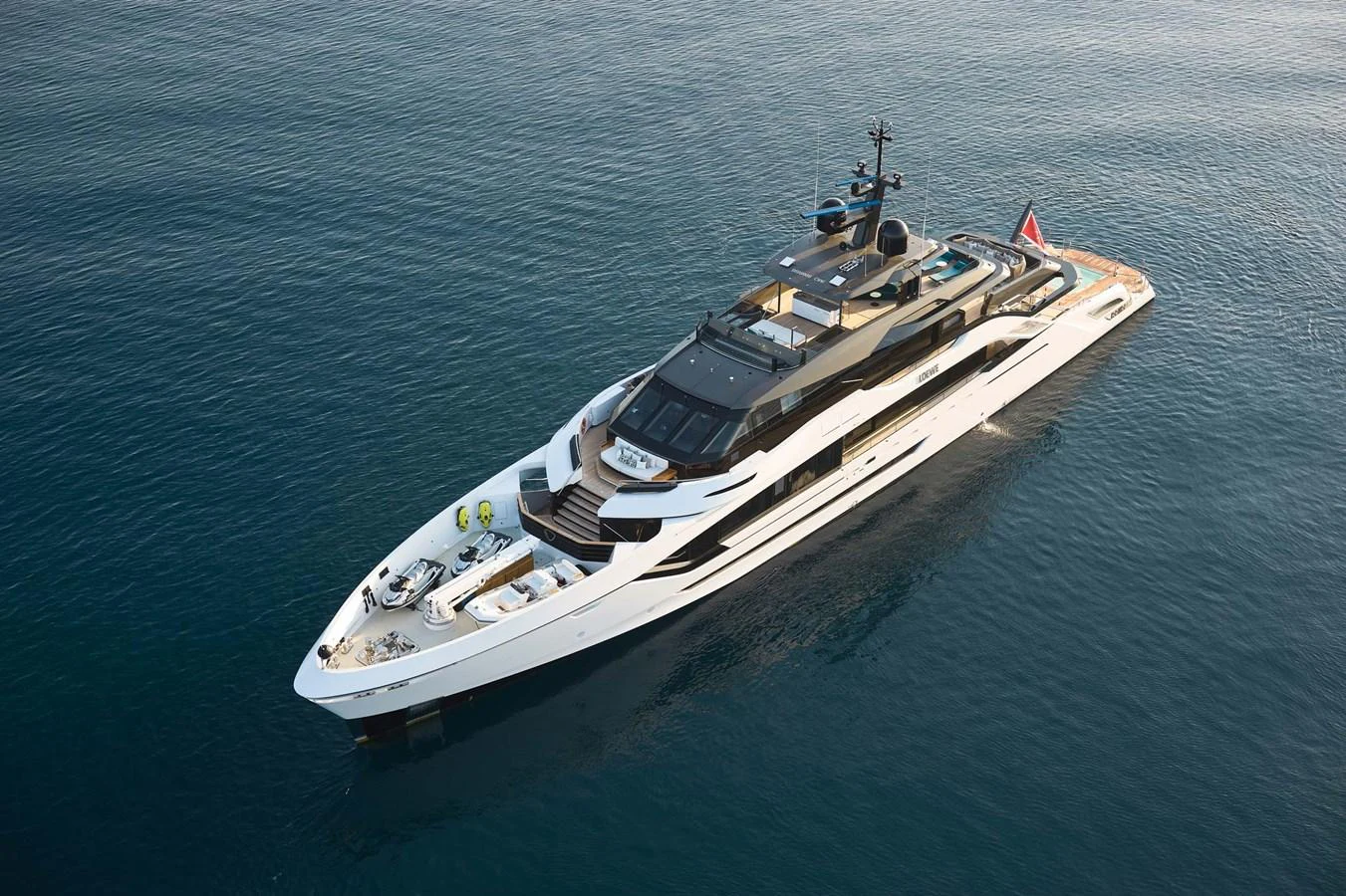 A sleek and modern yacht cruising on calm waters. aboard LOEWE Yacht for Sale