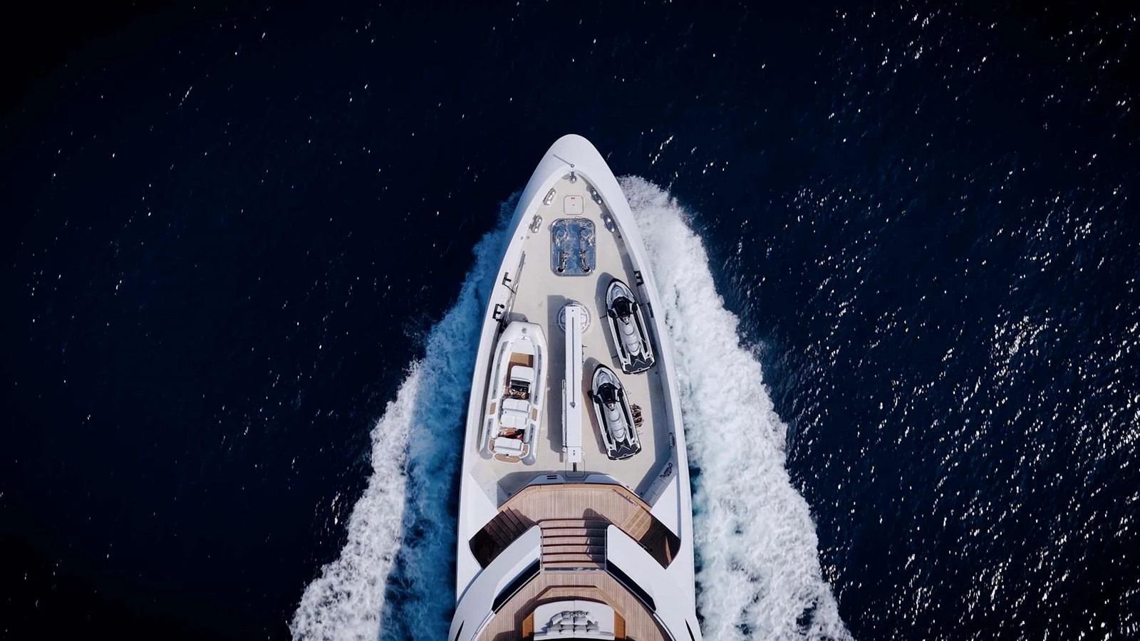 A stunning aerial view of the yacht's bow cutting through the water. aboard LOEWE Yacht for Sale