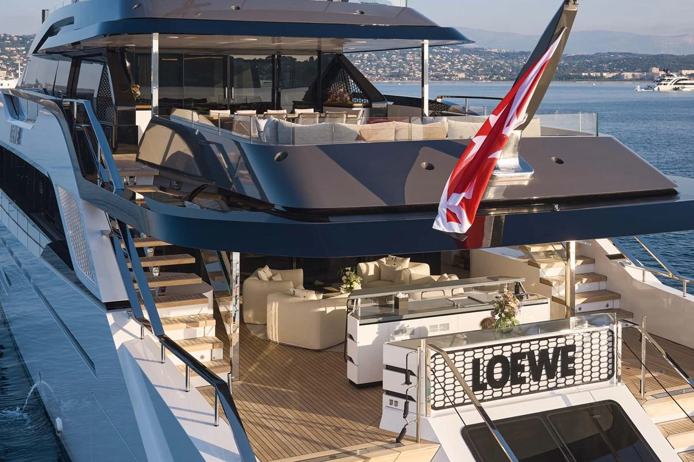 The yacht's aft deck features luxurious seating and a stylish design, perfect for relaxation and entertaining. aboard LOEWE Yacht for Sale