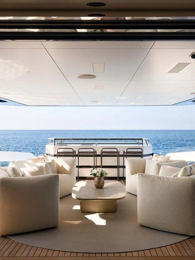 The aft deck offers a luxurious seating area with a stunning ocean view. aboard LOEWE Yacht for Sale