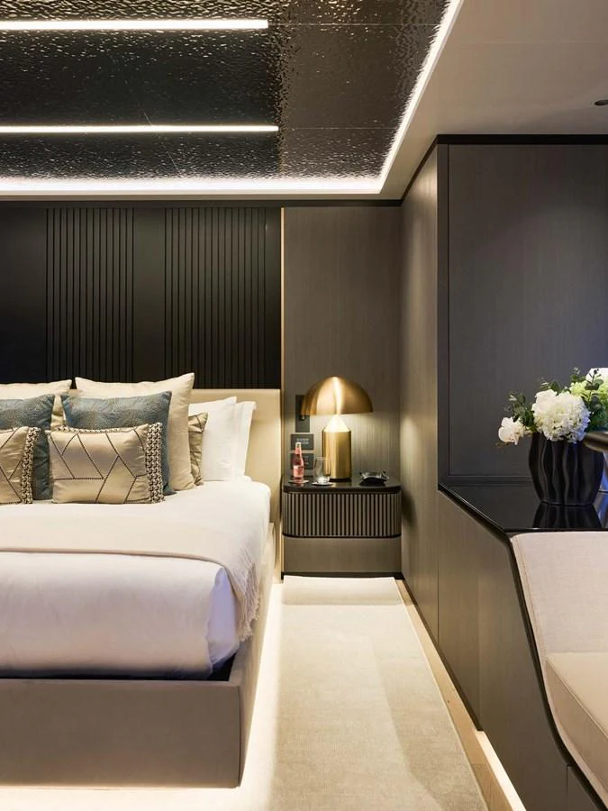 A luxurious stateroom with elegant lighting and modern decor. aboard LOEWE Yacht for Sale