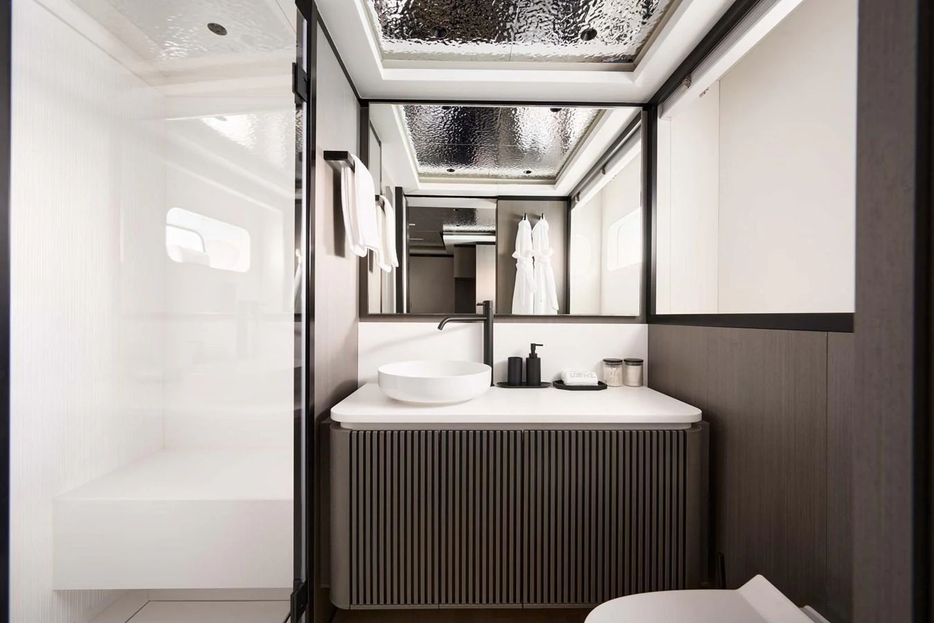 A sleek and modern bathroom with elegant fixtures and ample lighting. aboard LOEWE Yacht for Sale