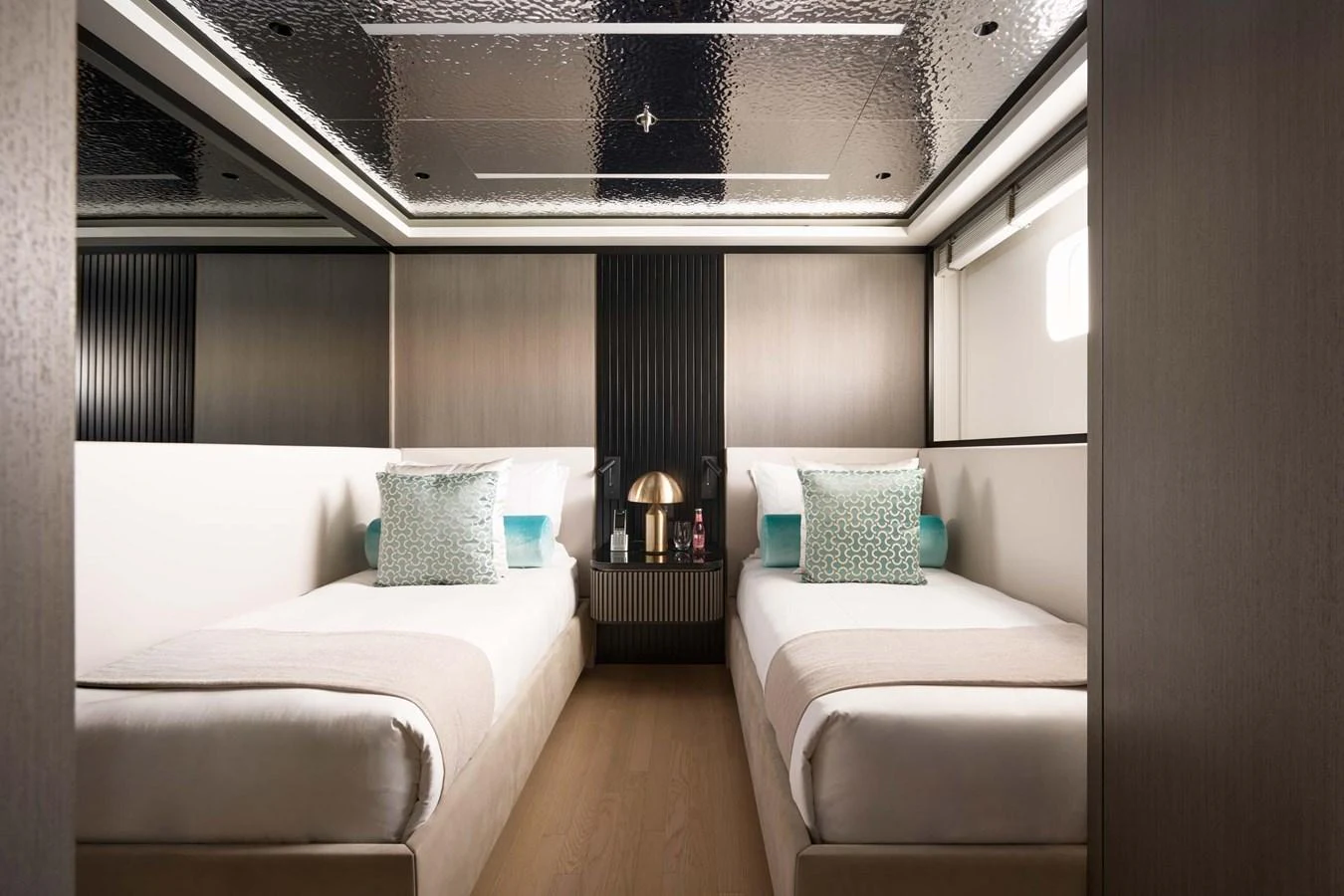 A modern twin stateroom featuring sleek design and luxurious bedding. aboard LOEWE Yacht for Sale