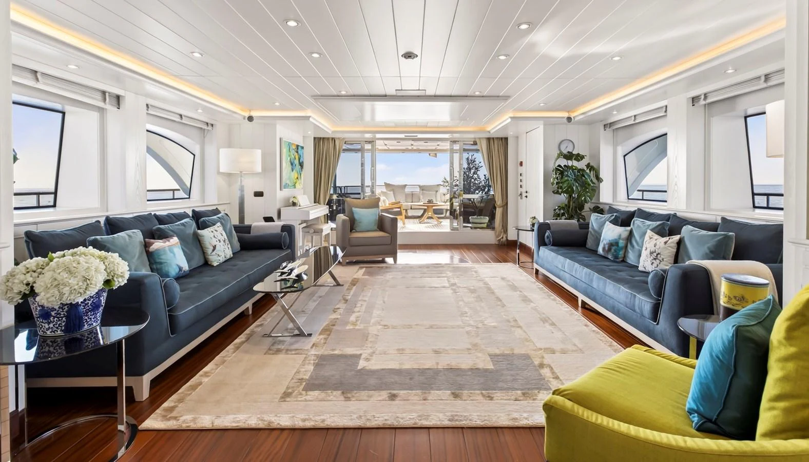 The spacious salon features elegant seating and ample natural light, creating a luxurious and inviting atmosphere. aboard LADY TRUDY Yacht for Sale