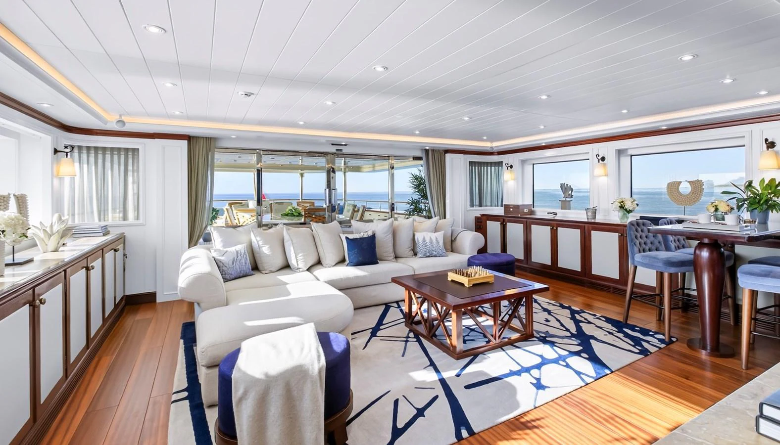 The salon offers a spacious and elegantly designed living area with panoramic ocean views. aboard LADY TRUDY Yacht for Sale