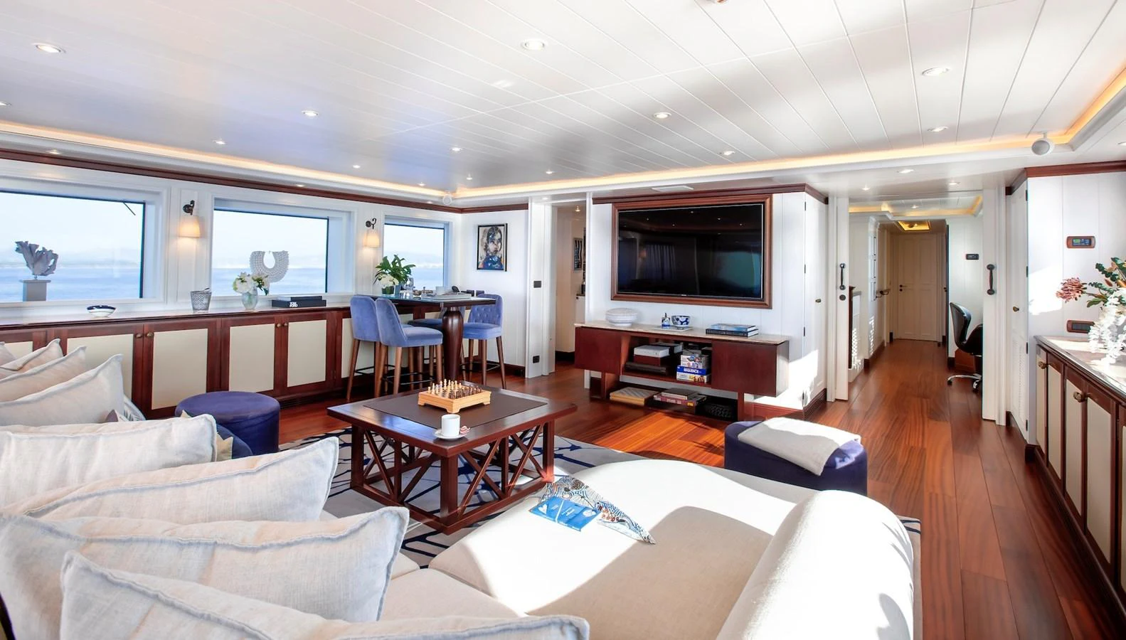 The salon features elegant furnishings and ample natural light, creating a luxurious and inviting atmosphere. aboard LADY TRUDY Yacht for Sale