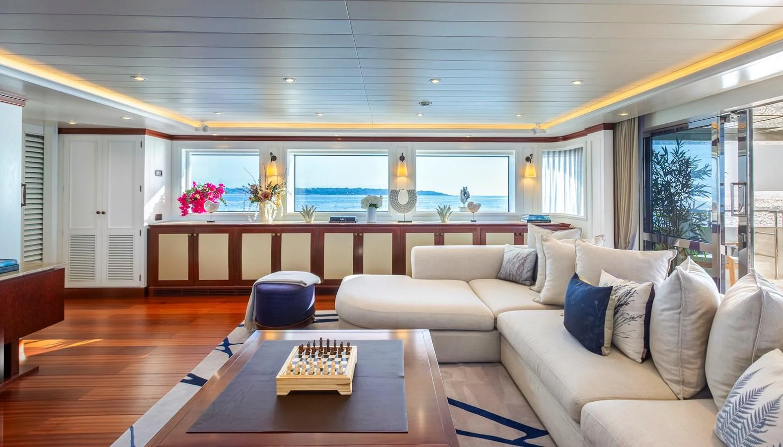 The salon offers a spacious and luxurious area with ample seating and panoramic views. aboard LADY TRUDY Yacht for Sale