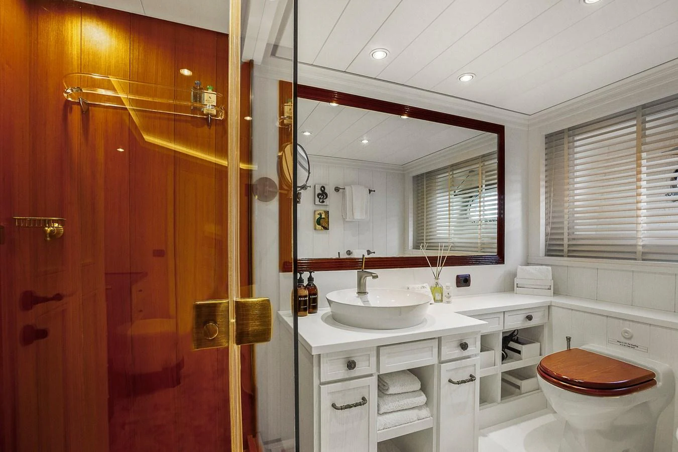 The yacht's bathroom features elegant fixtures and a luxurious design. aboard LADY TRUDY Yacht for Sale