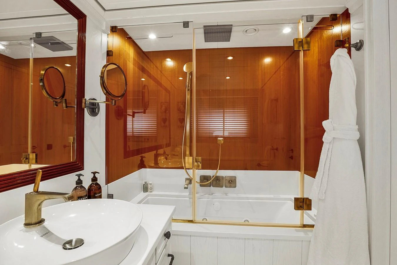 This luxurious yacht bathroom features a modern sink, elegant fixtures, and a spacious shower area. aboard LADY TRUDY Yacht for Sale