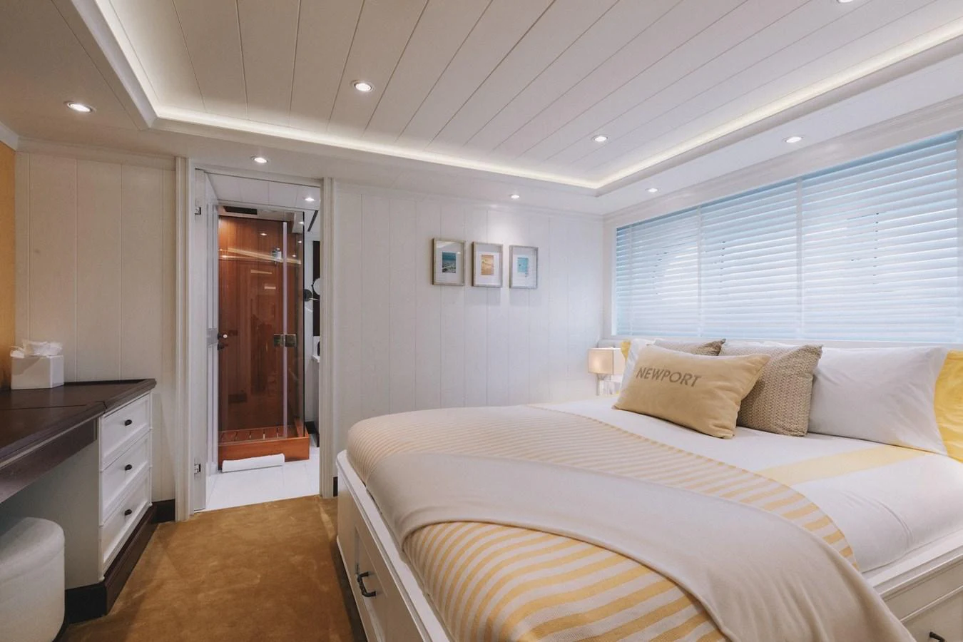 The stateroom features a cozy bed with elegant linens and ample natural light. aboard LADY TRUDY Yacht for Sale