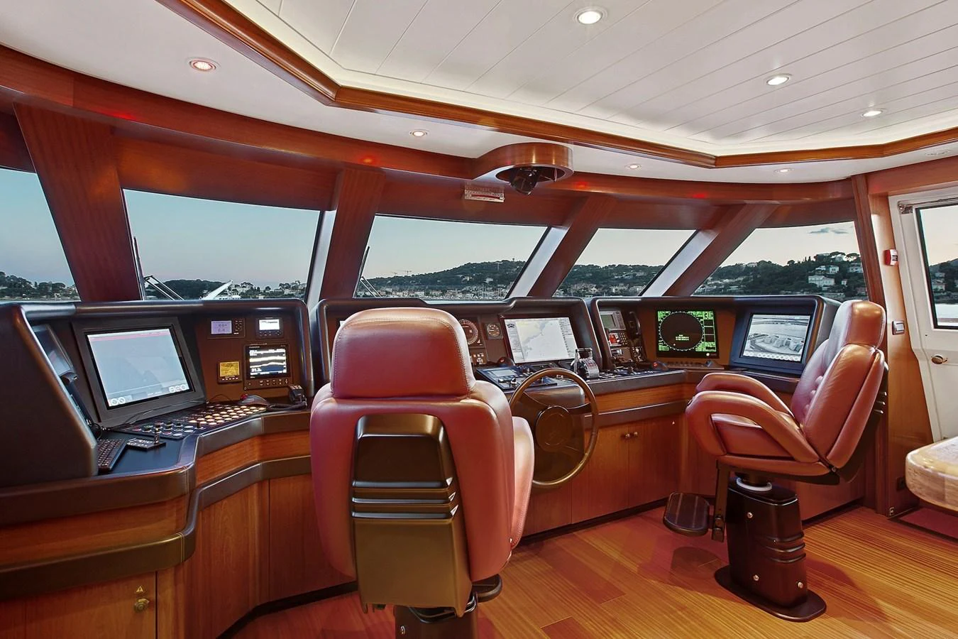 The helm station features state-of-the-art navigation equipment and luxurious seating. aboard LADY TRUDY Yacht for Sale
