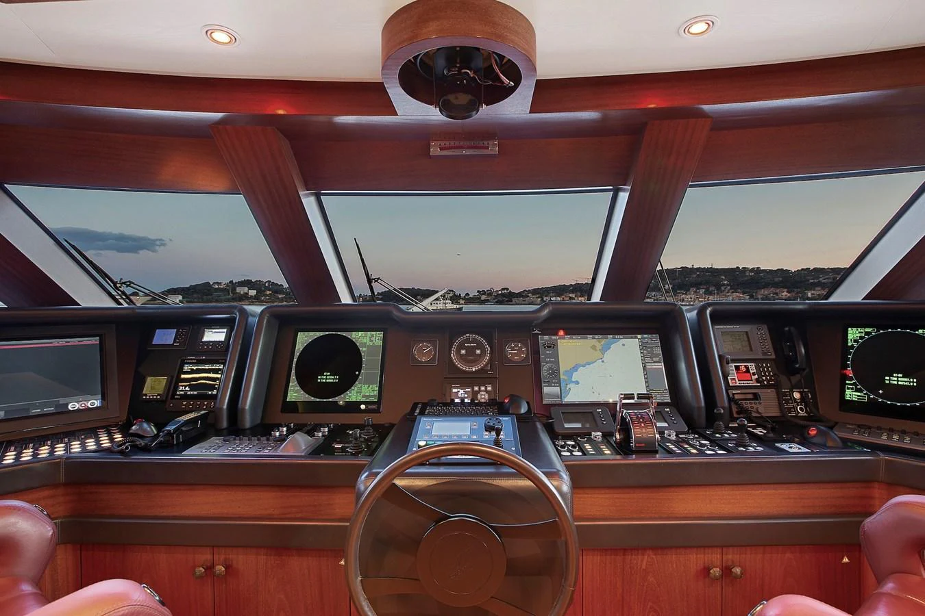The helm features advanced navigation equipment and a panoramic view. aboard LADY TRUDY Yacht for Sale