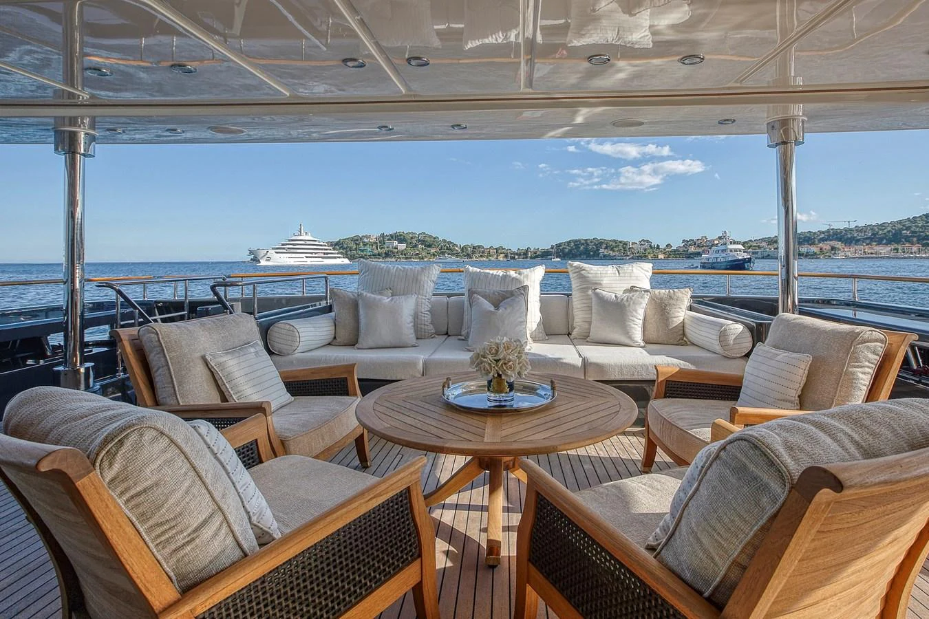 The aft deck offers a luxurious seating area with a stunning view of the sea. aboard LADY TRUDY Yacht for Sale
