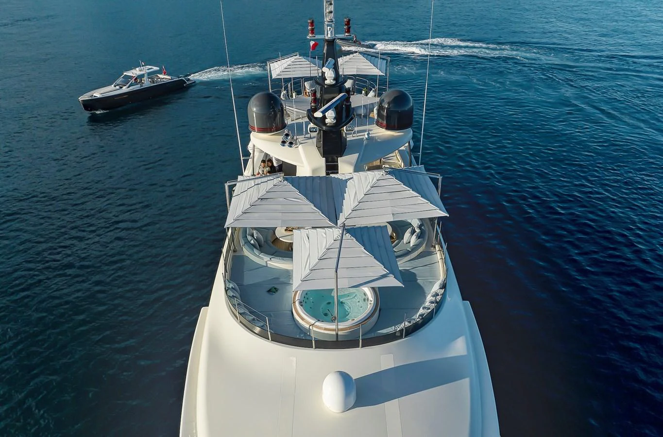 The yacht's sundeck features a luxurious hot tub and ample shaded lounging areas, perfect for relaxation. aboard LADY TRUDY Yacht for Sale