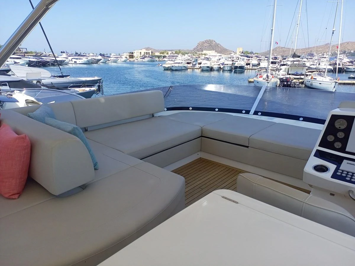The flybridge offers a spacious seating area with a scenic view of the marina. aboard ANM Yacht for Sale