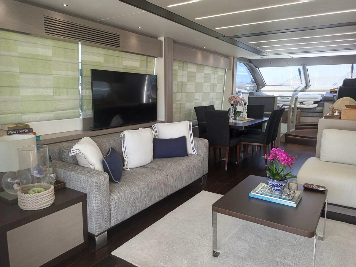 The yacht's salon features a comfortable seating area with a modern design and ample natural light. aboard ANM Yacht for Sale
