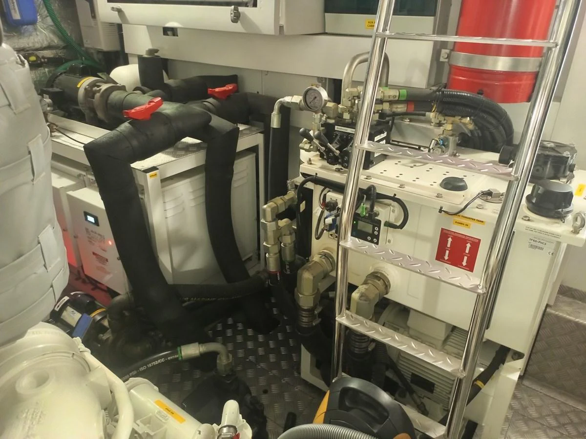 The image shows the engine room with various mechanical components and equipment. aboard ANM Yacht for Sale