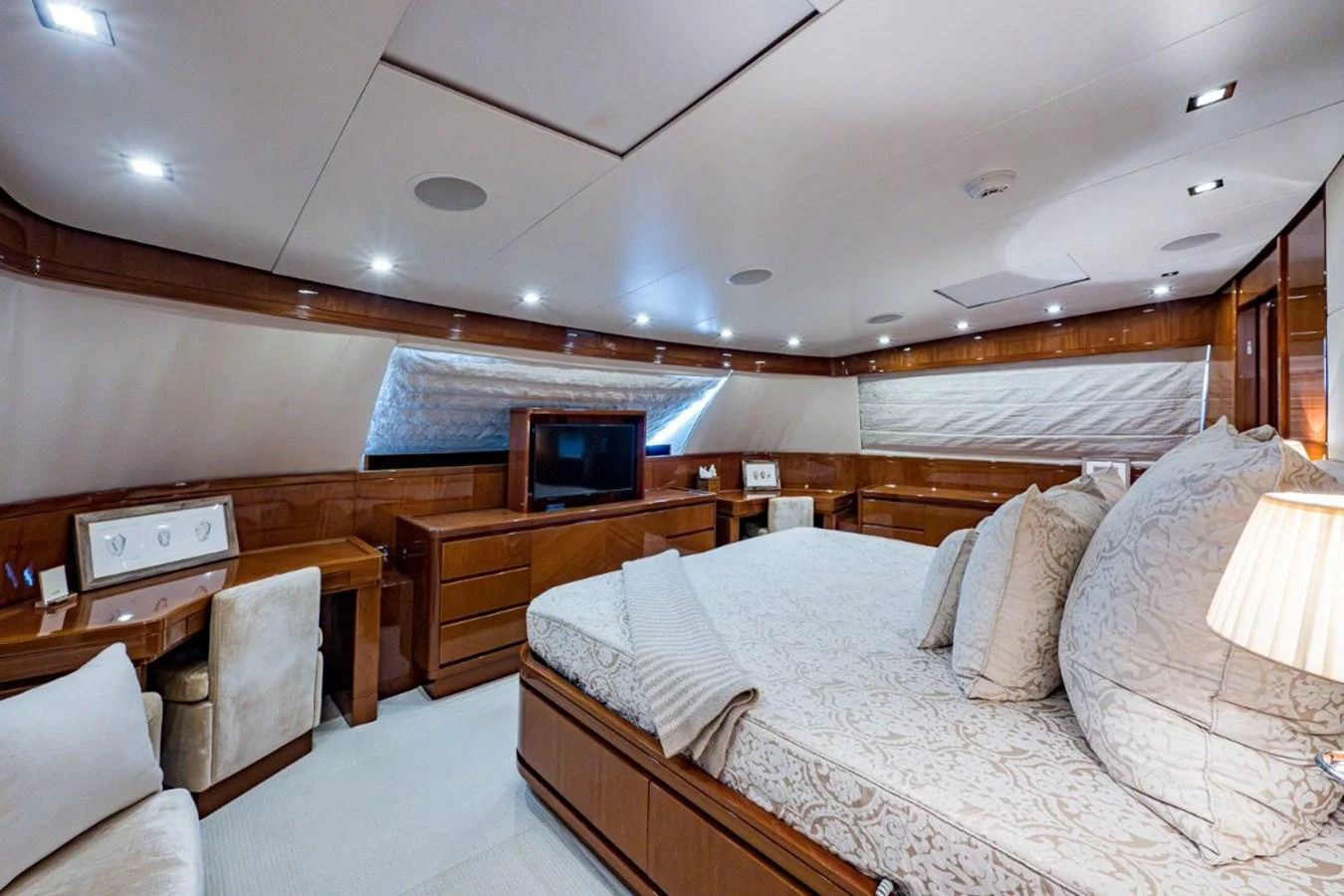 The master stateroom features luxurious bedding, ample storage, and elegant wood finishes. aboard ALEGHI Yacht for Sale