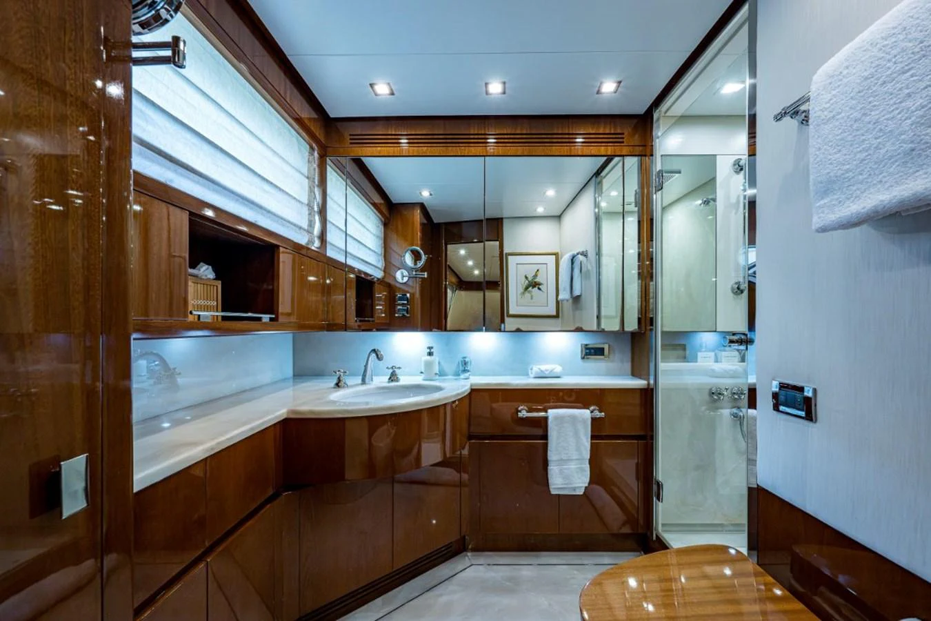 The yacht's bathroom features elegant wood finishes and modern fixtures, creating a luxurious and comfortable space. aboard ALEGHI Yacht for Sale