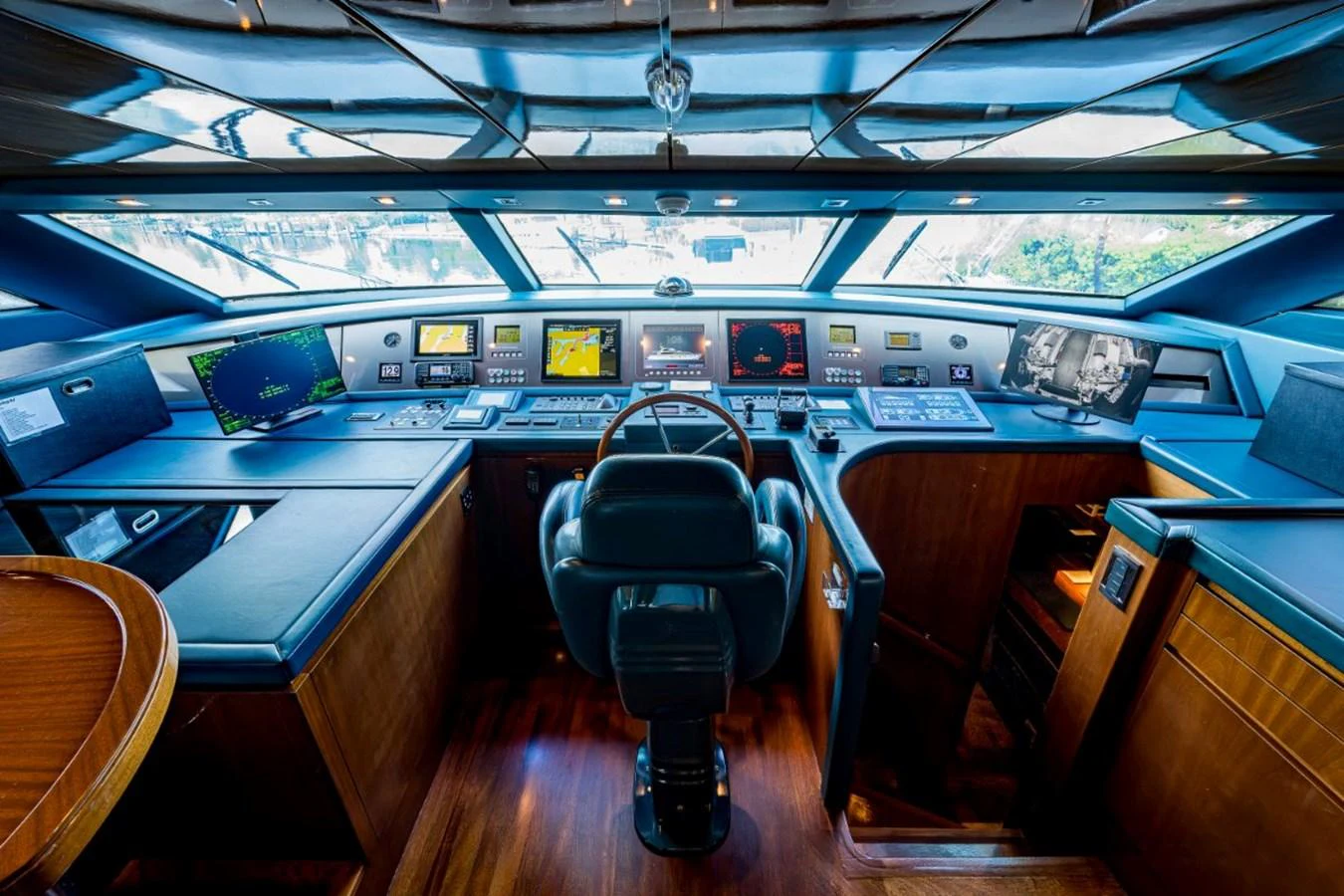 The helm station features state-of-the-art navigation equipment and luxurious wood finishes. aboard ALEGHI Yacht for Sale