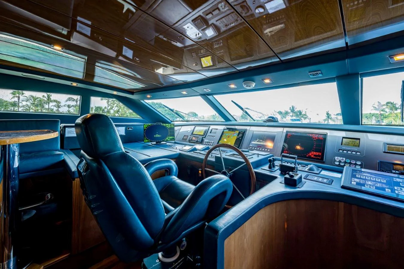 The helm station features advanced navigation equipment and luxurious seating, offering a commanding view for the captain. aboard ALEGHI Yacht for Sale