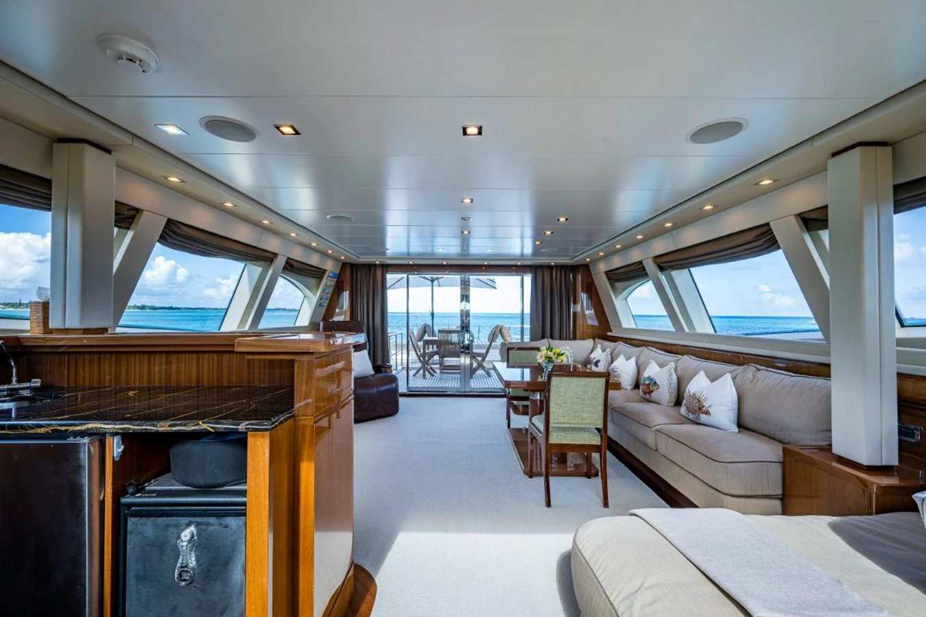 The spacious salon offers panoramic views and luxurious seating arrangements. aboard ALEGHI Yacht for Sale