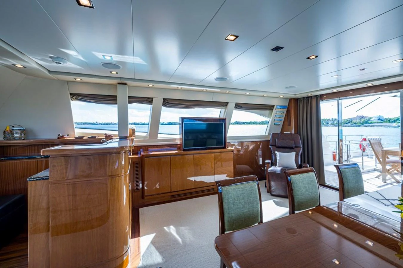 The spacious salon offers a luxurious and comfortable area with ample natural light and elegant furnishings. aboard ALEGHI Yacht for Sale