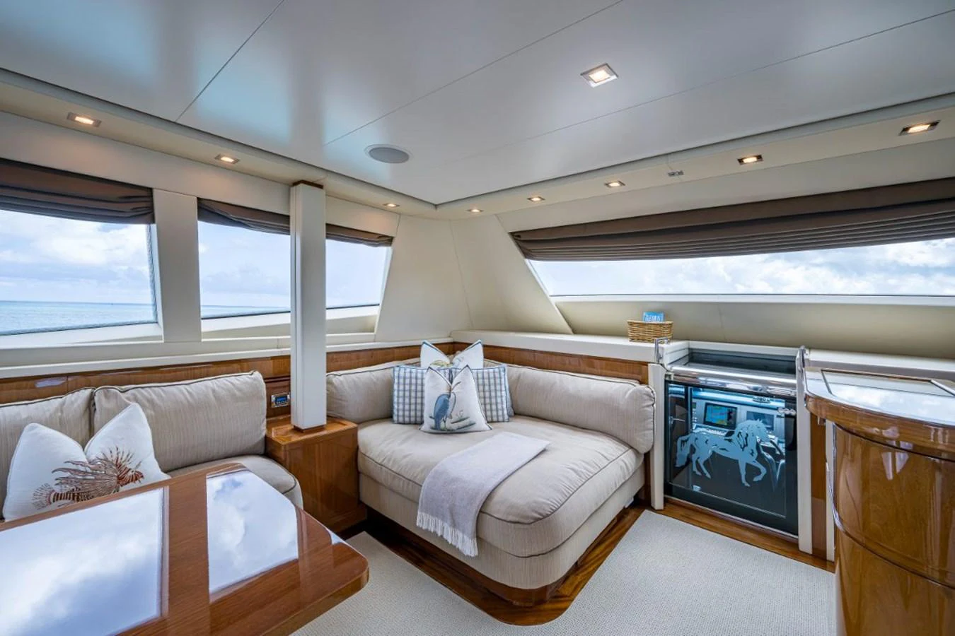 The yacht's salon features plush seating, large windows, and elegant decor, creating a comfortable and inviting space. aboard ALEGHI Yacht for Sale