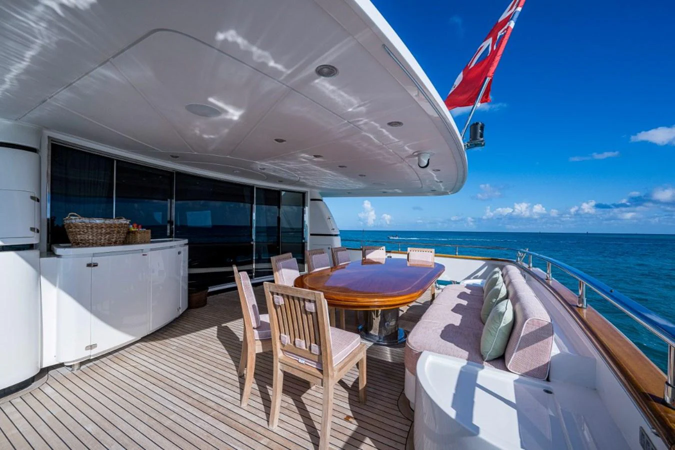 The aft deck offers a spacious and inviting area for alfresco dining with stunning ocean views. aboard ALEGHI Yacht for Sale