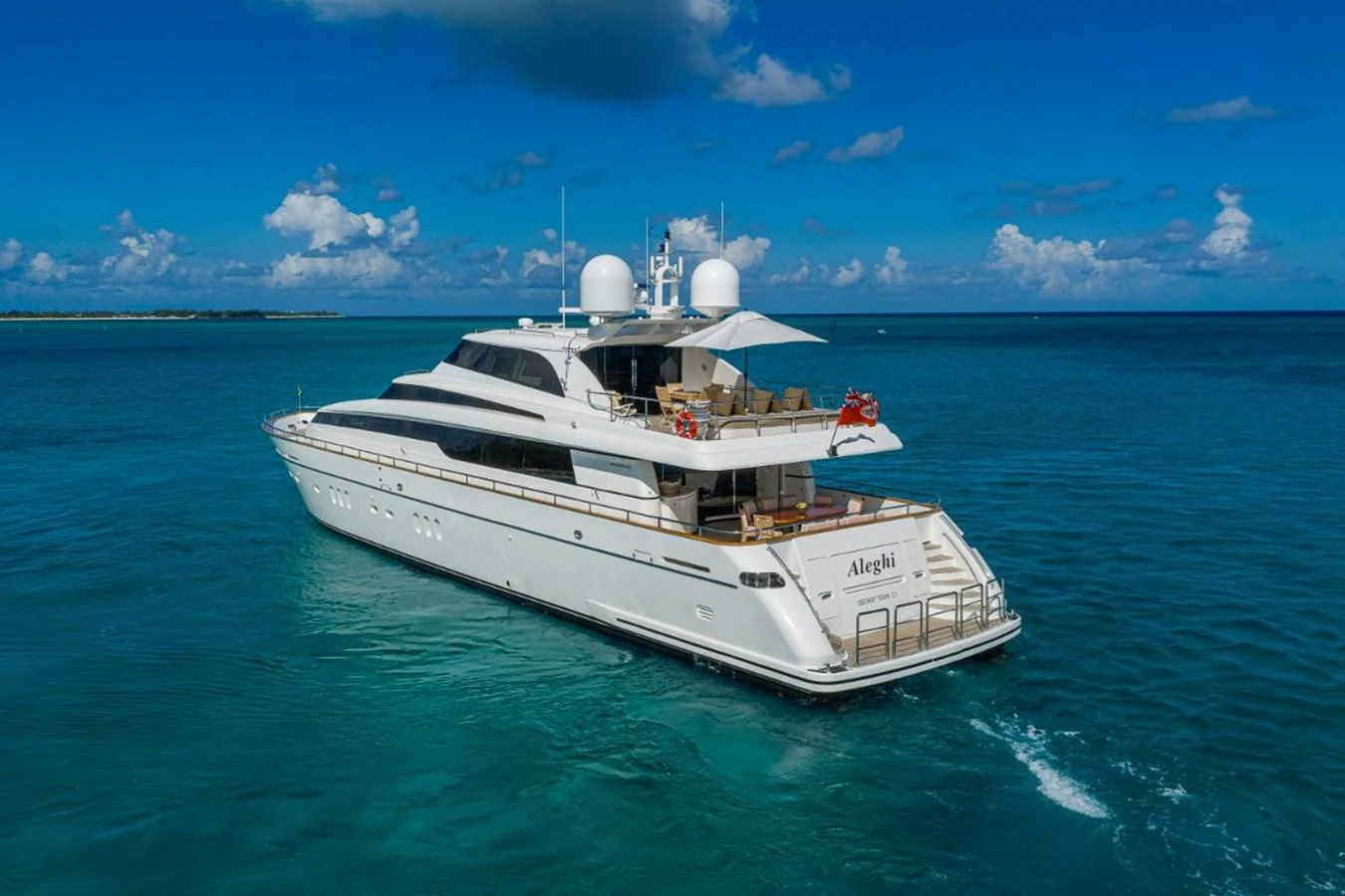 A sleek and modern yacht cruising on clear blue waters under a bright sky. aboard ALEGHI Yacht for Sale