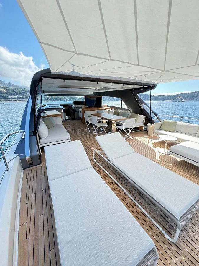 The flybridge offers a spacious and luxurious outdoor lounging area with stunning views. aboard BELLA B Yacht for Sale