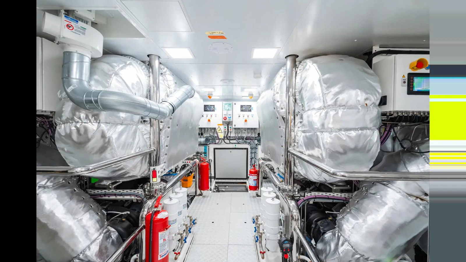 The yacht's engine room showcases advanced machinery and safety equipment. aboard BIG SHARK Yacht for Sale