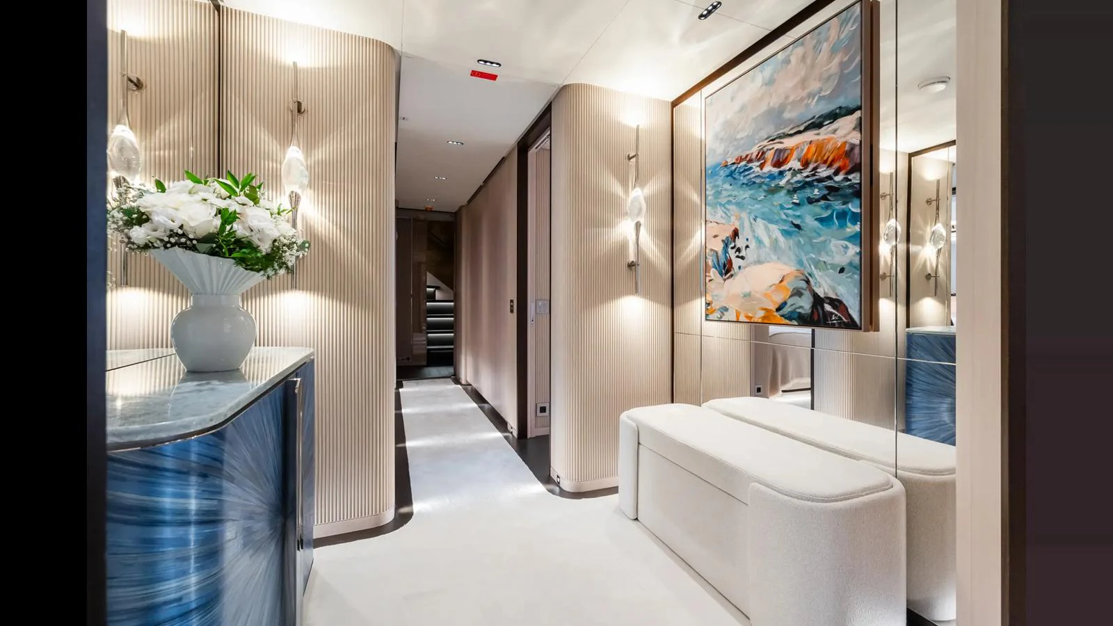The yacht's interior features a stylish hallway with elegant decor and contemporary artwork. aboard BIG SHARK Yacht for Sale