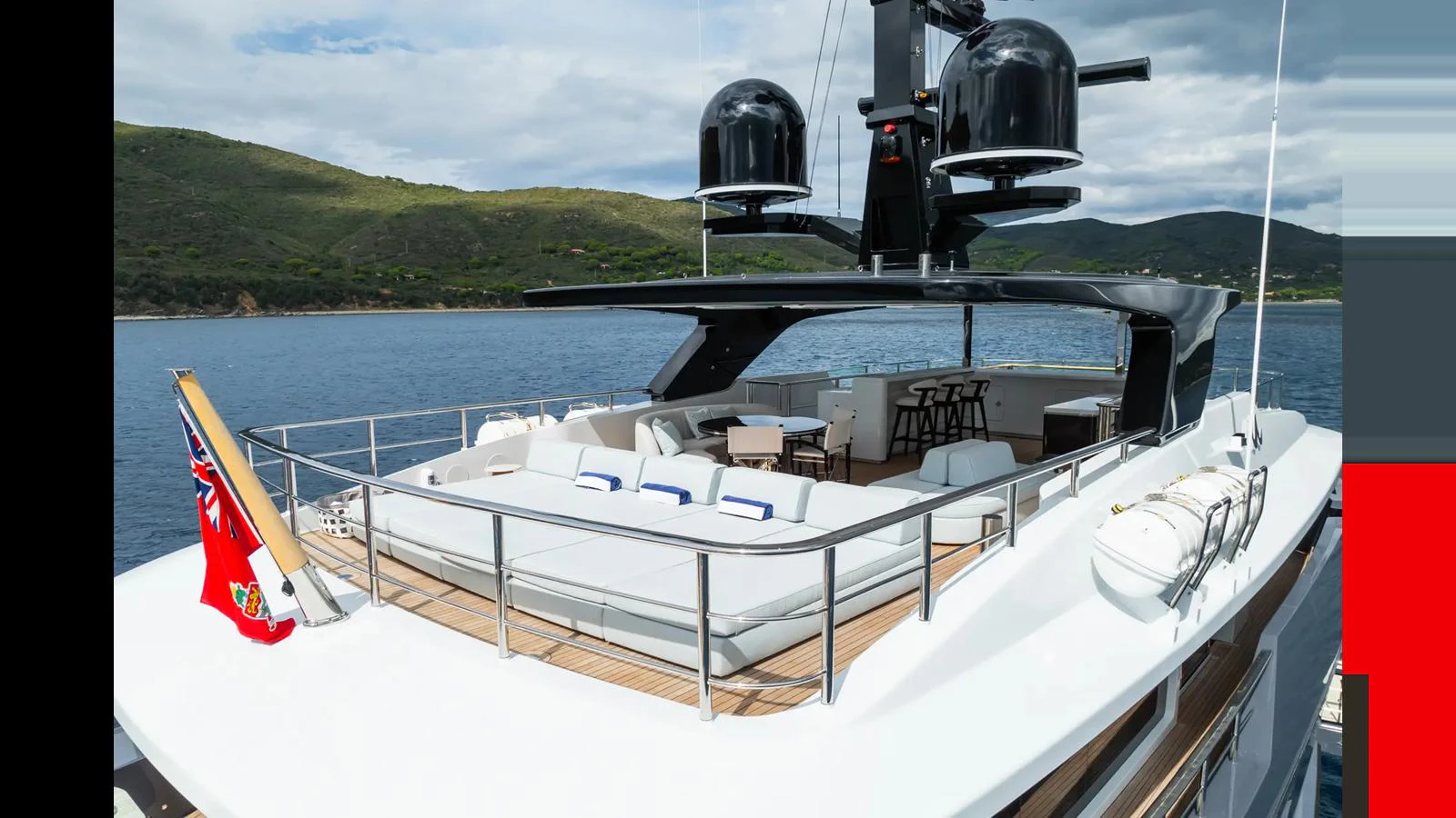 The yacht's flybridge offers a spacious and luxurious outdoor seating area with stunning views of the surrounding waters. aboard BIG SHARK Yacht for Sale