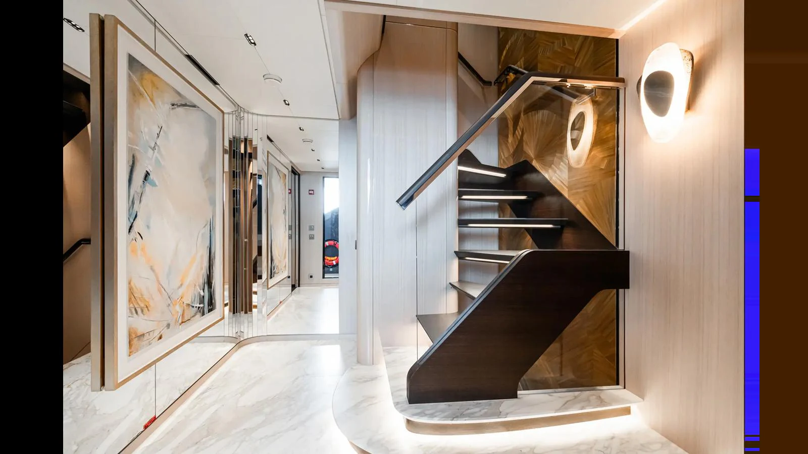 A modern and elegant staircase with sleek design elements and ambient lighting. aboard BIG SHARK Yacht for Sale