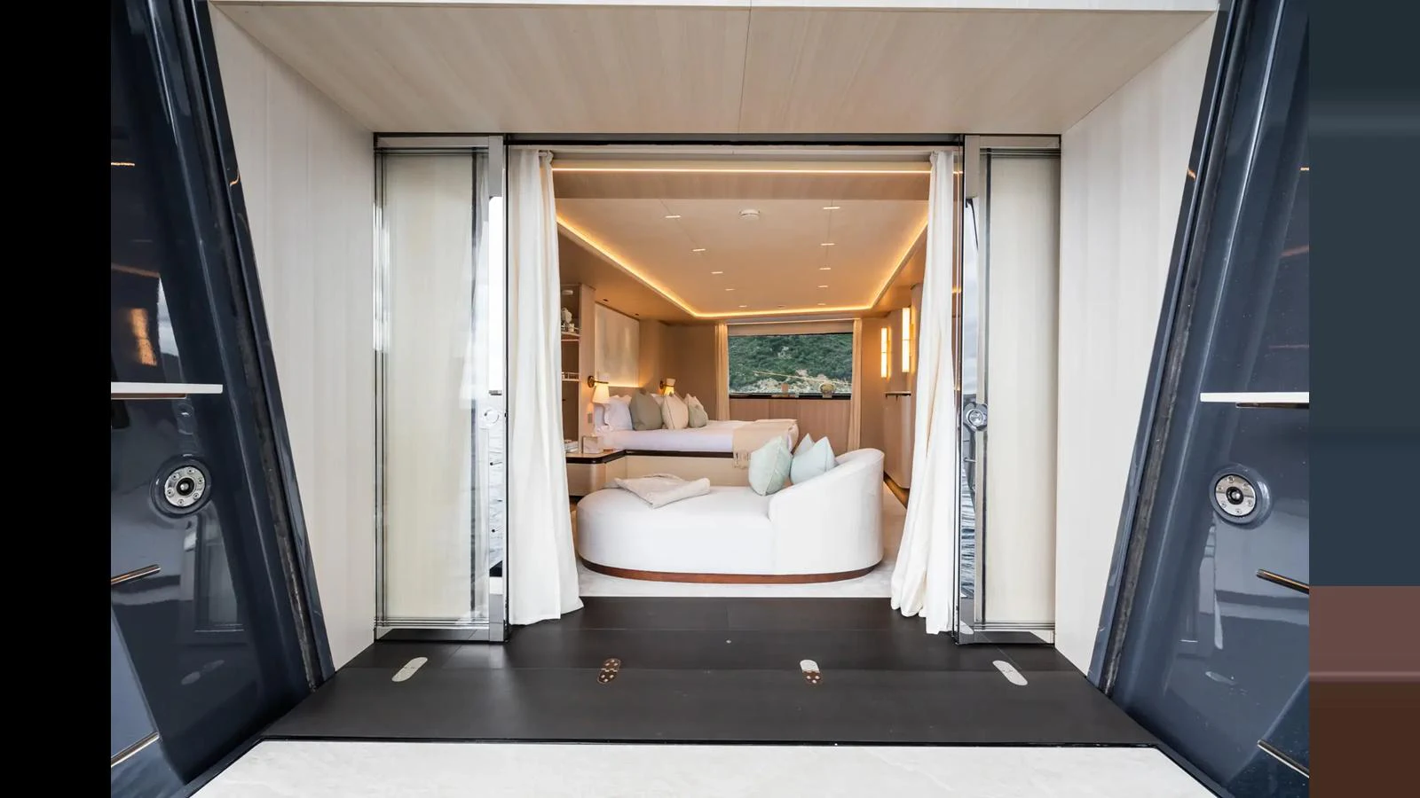 A luxurious interior space with a cozy seating area and elegant lighting. aboard BIG SHARK Yacht for Sale