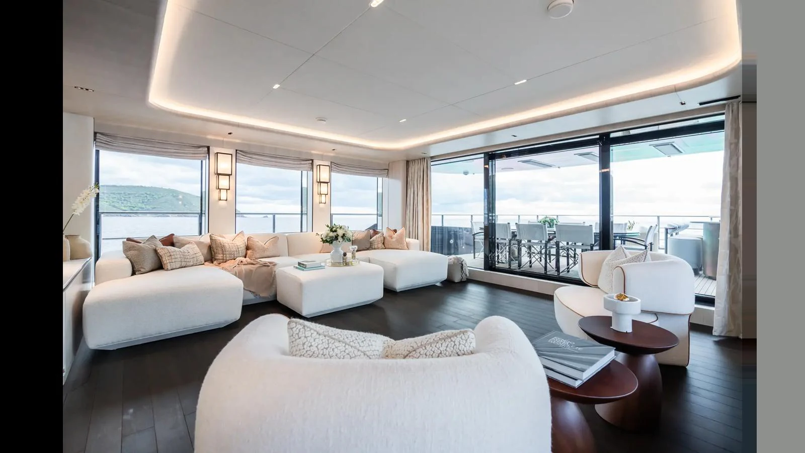 The spacious salon offers a luxurious and comfortable seating area with panoramic views. aboard BIG SHARK Yacht for Sale