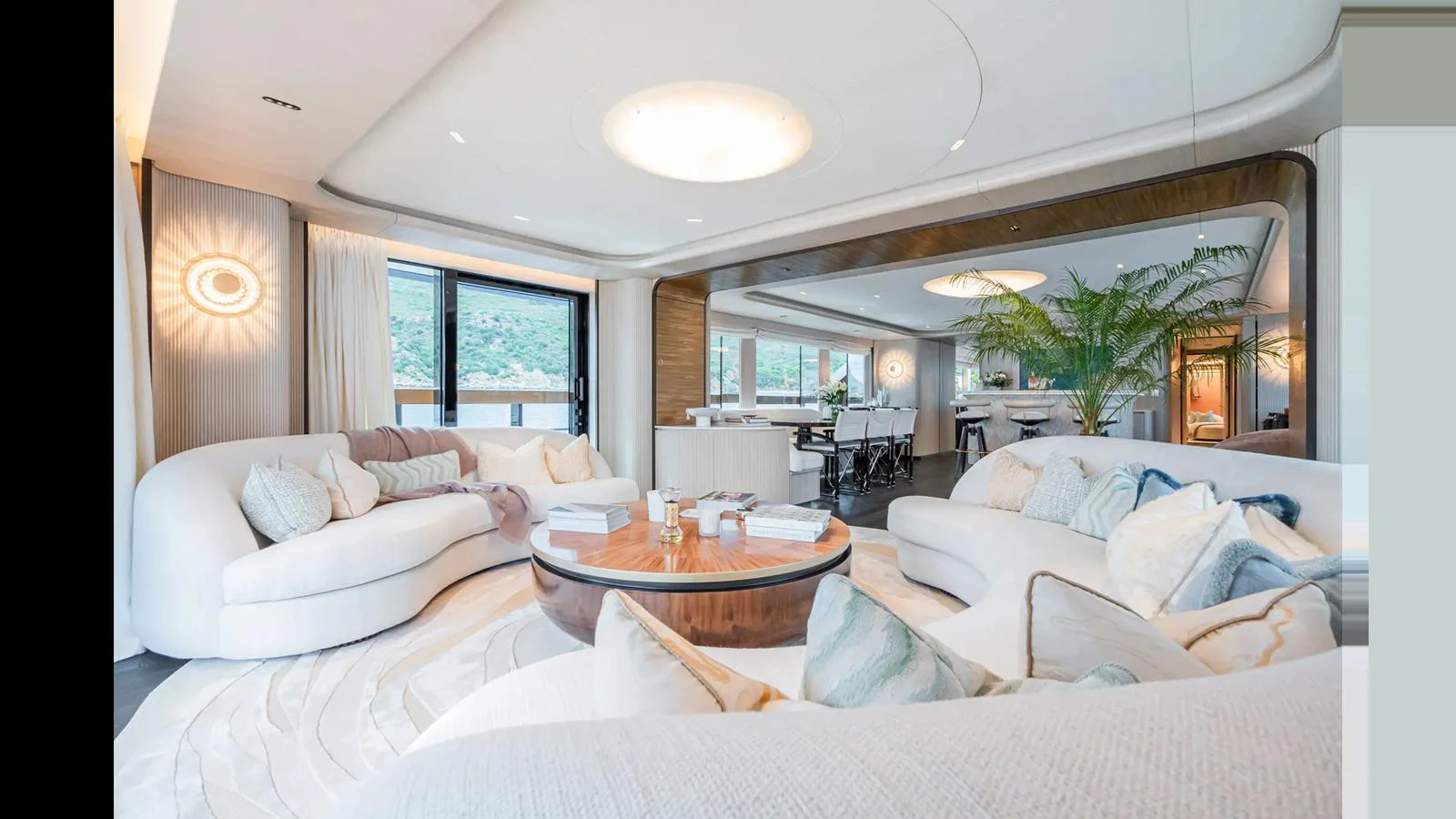 The salon offers a spacious and elegantly designed living area with plush seating and modern decor. aboard BIG SHARK Yacht for Sale
