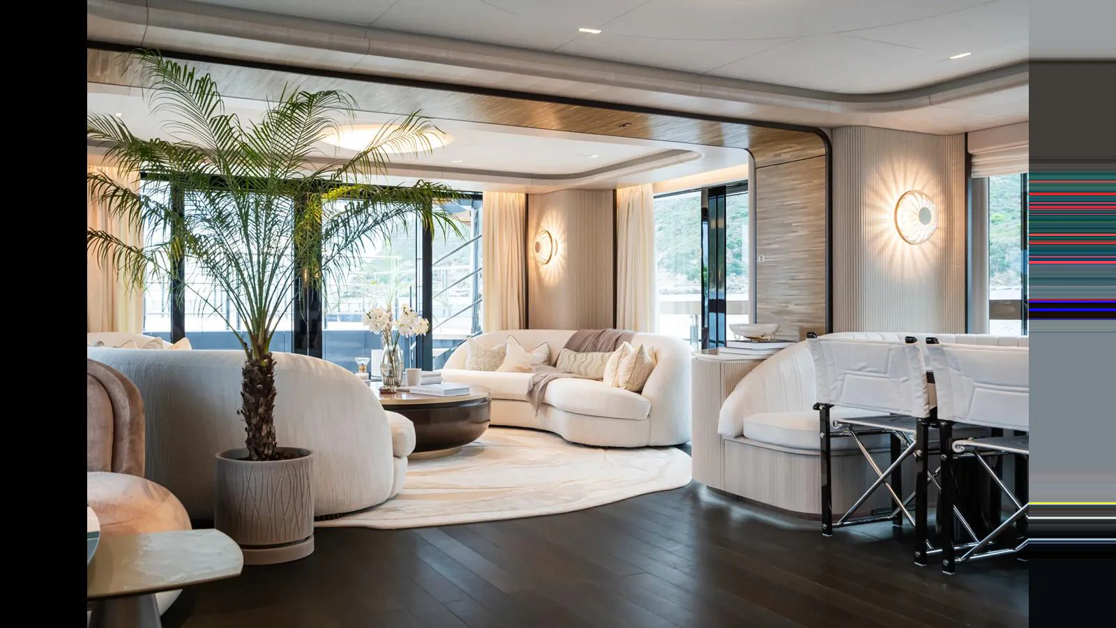The yacht's interior features a spacious and elegantly designed living area with plush seating and modern decor. aboard BIG SHARK Yacht for Sale