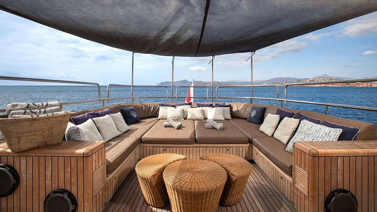 The sundeck offers a spacious and comfortable seating area with panoramic ocean views. aboard YCM 120 Yacht for Sale