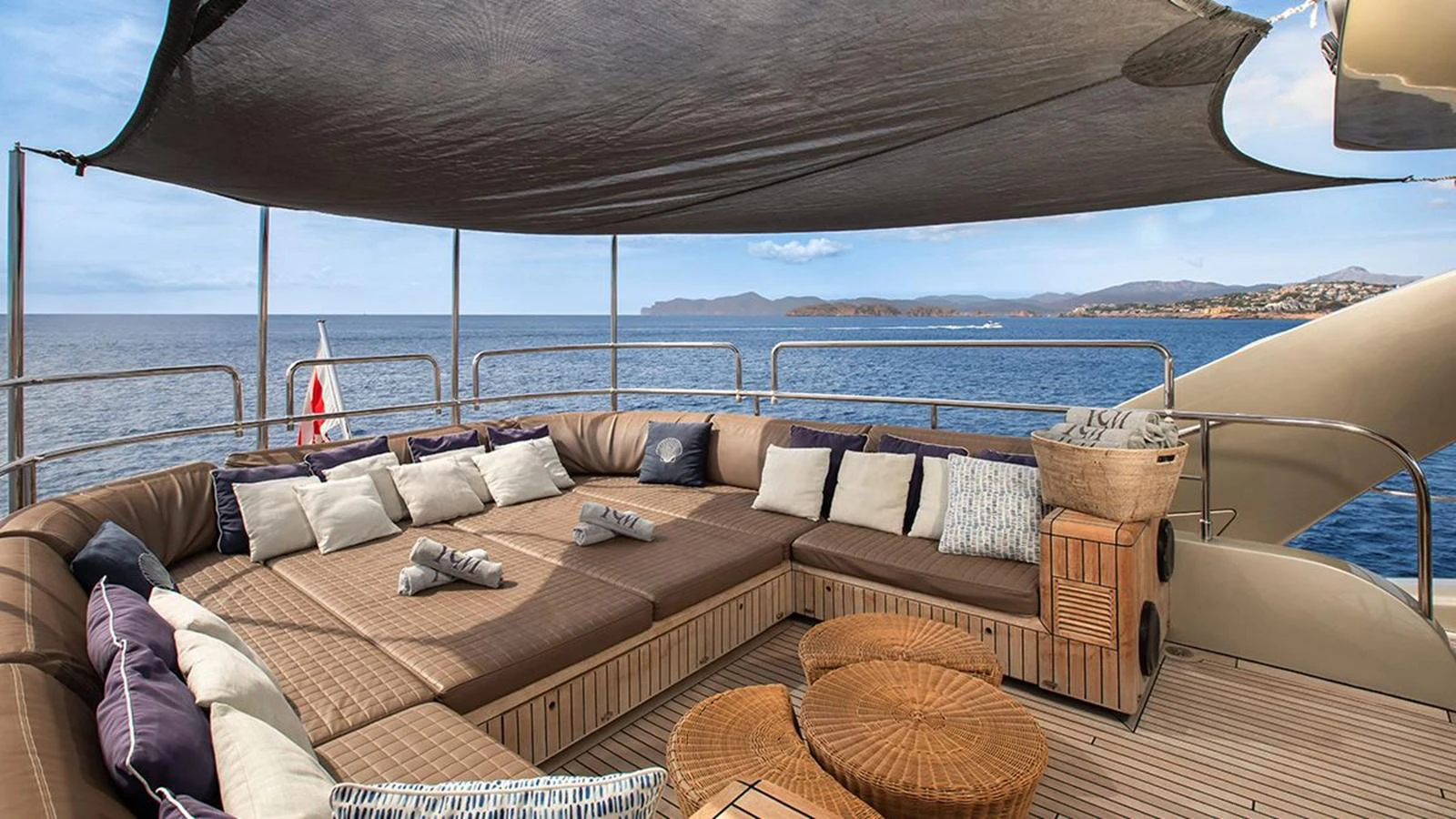 The sundeck offers a spacious lounging area with comfortable seating and stunning ocean views. aboard YCM 120 Yacht for Sale