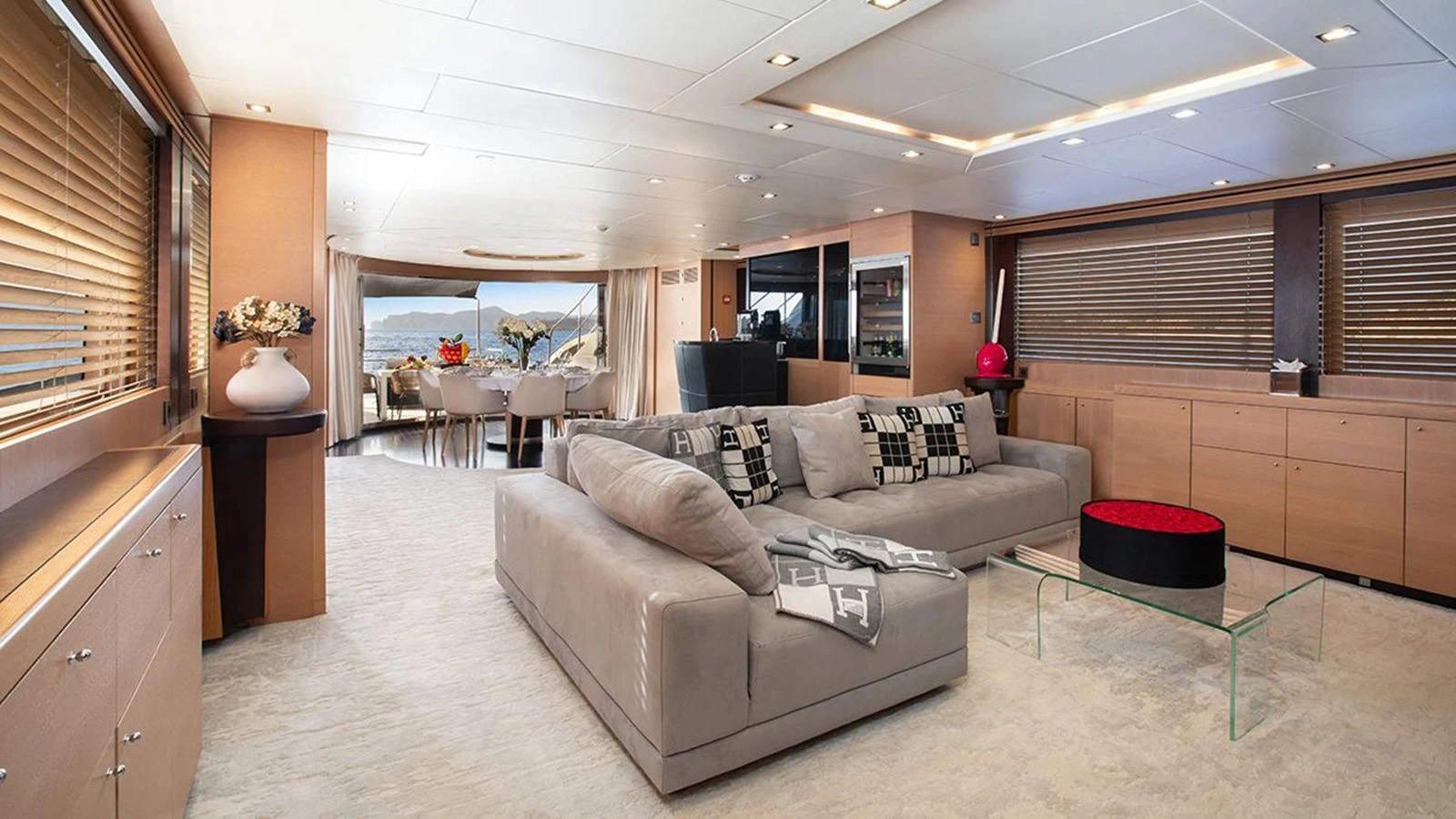 The yacht's salon features a spacious and elegantly designed seating area with modern furnishings and ample natural light. aboard YCM 120 Yacht for Sale
